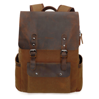 Brown leather backpack with silver buckles on a white background