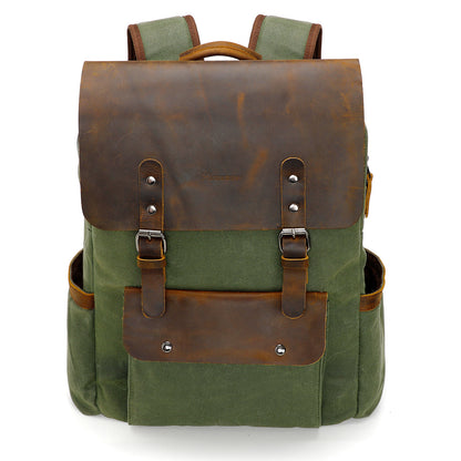 Green backpack with brown leather straps and accents on a white background
