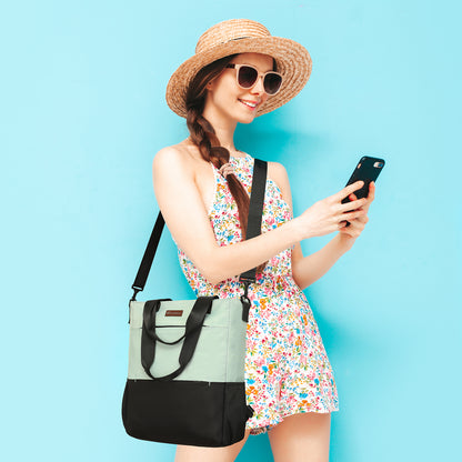 Woman in a floral dress and straw hat holding a phone against a blue background